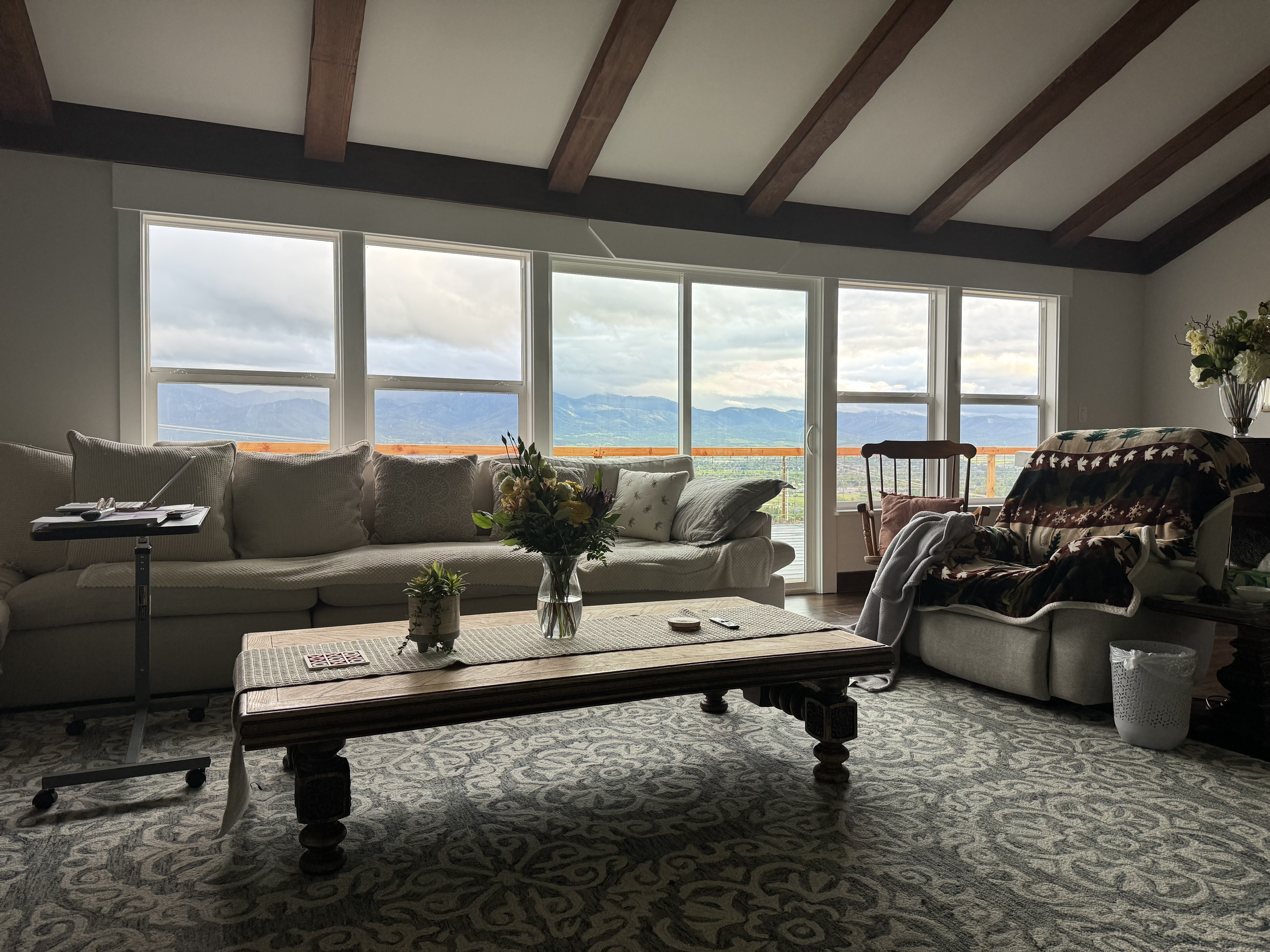 Common living area with vaulted wood-beam ceiling